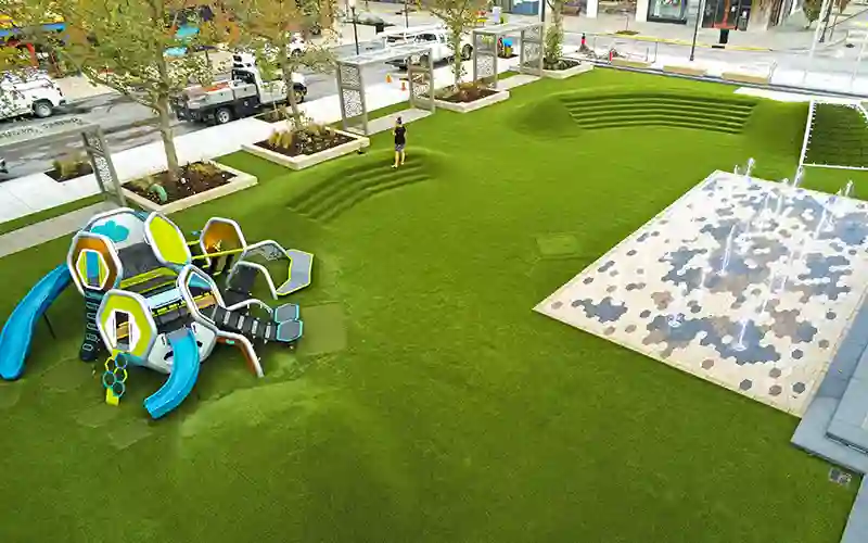 image of SYNLawn artificial grass with playground and water feature